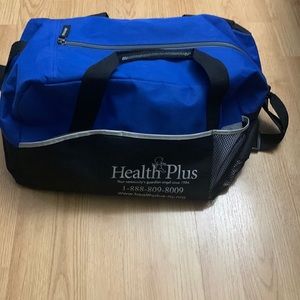 A blue Health Plus duffel bag. Size: small